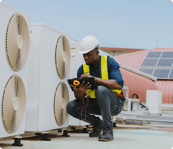 Engineer checking HVAC system with tablet